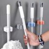 Self-adhesive mop holder clip for easy storage
